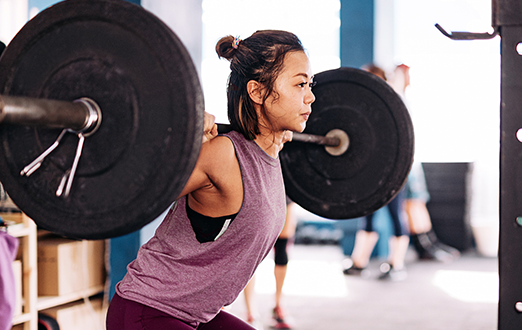 A person doing carrying the weight on their shoulders